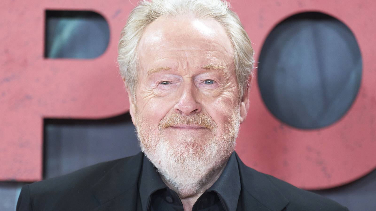 Ridley Scott smiling on the red carpet