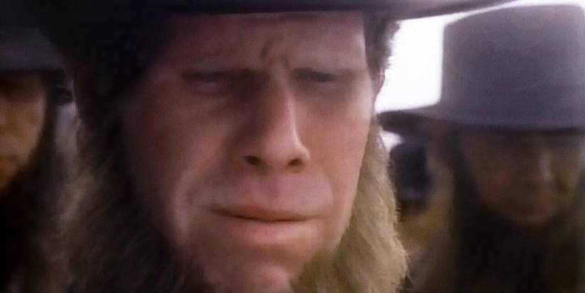 Ron Perlman in 'A Stoning in Fulham County', looking down with a sad face