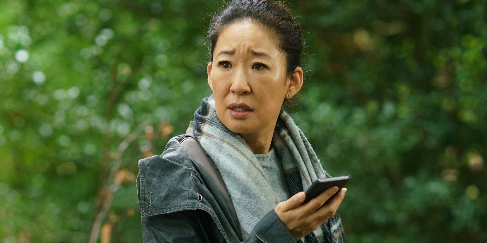 Sandra Oh checking her phone in 'Killing Eve'