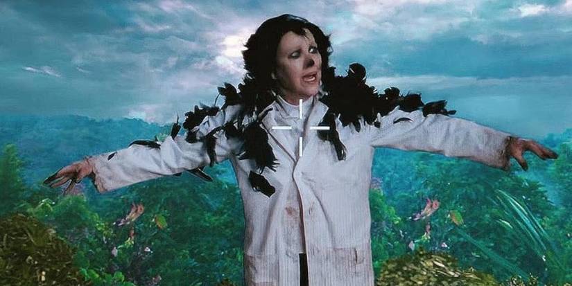 Catherine O'Hara as Moira Rose with black feathers on her shoulders in the 'Schitt's Creek' episode 'The Crowneing.'