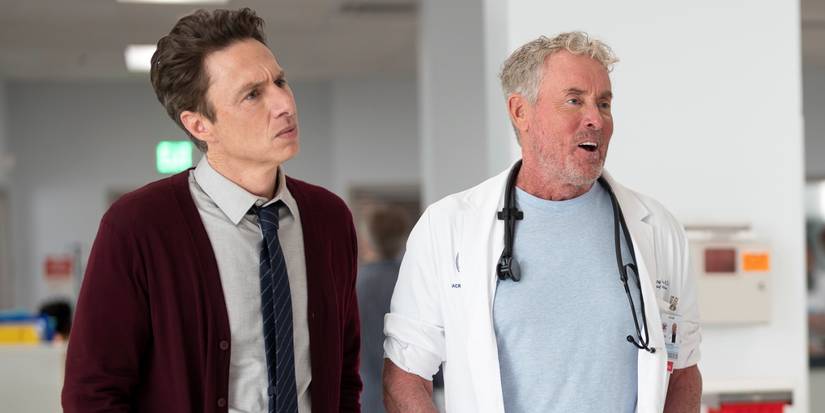 John C. McGinley as Dr. Cox standing next to Zach Braff as J.D. in the revival of Scrubs