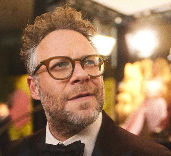 Seth Rogen looking up with a movie set behind him in The Studio.
