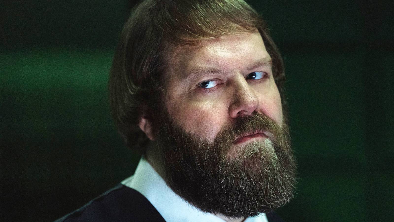 Jon Pack in Severance, looking skeptical