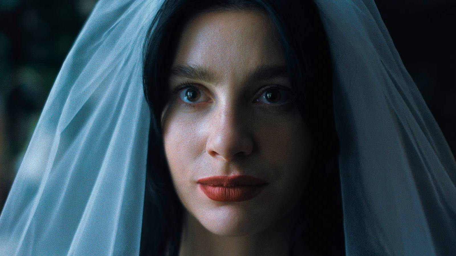 Camila Morrone smiling in a wedding dress in Something Very Bad Is Going to Happen