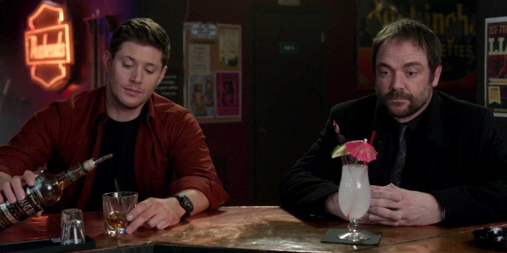 Dean Winchester (Jensen Ackles) speaks with Crowley (Mark A. Sheppard) at a bar in the 'Supernatural' episode "Inside Man"