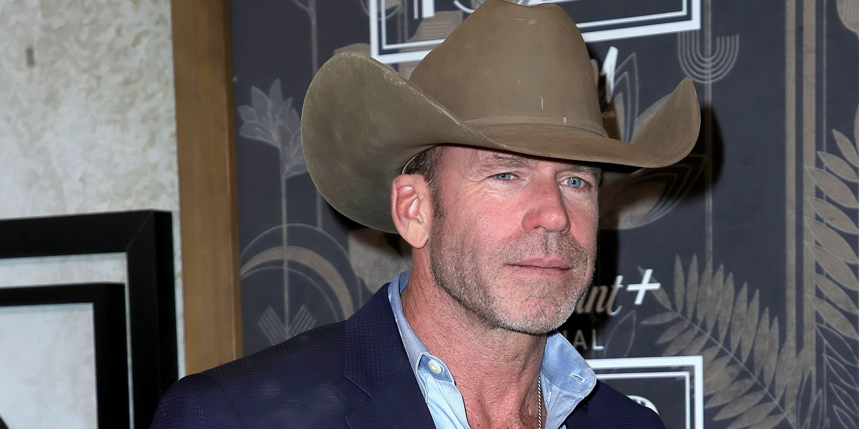 Taylor Sheridan wears a cowboy hat on the red carpet