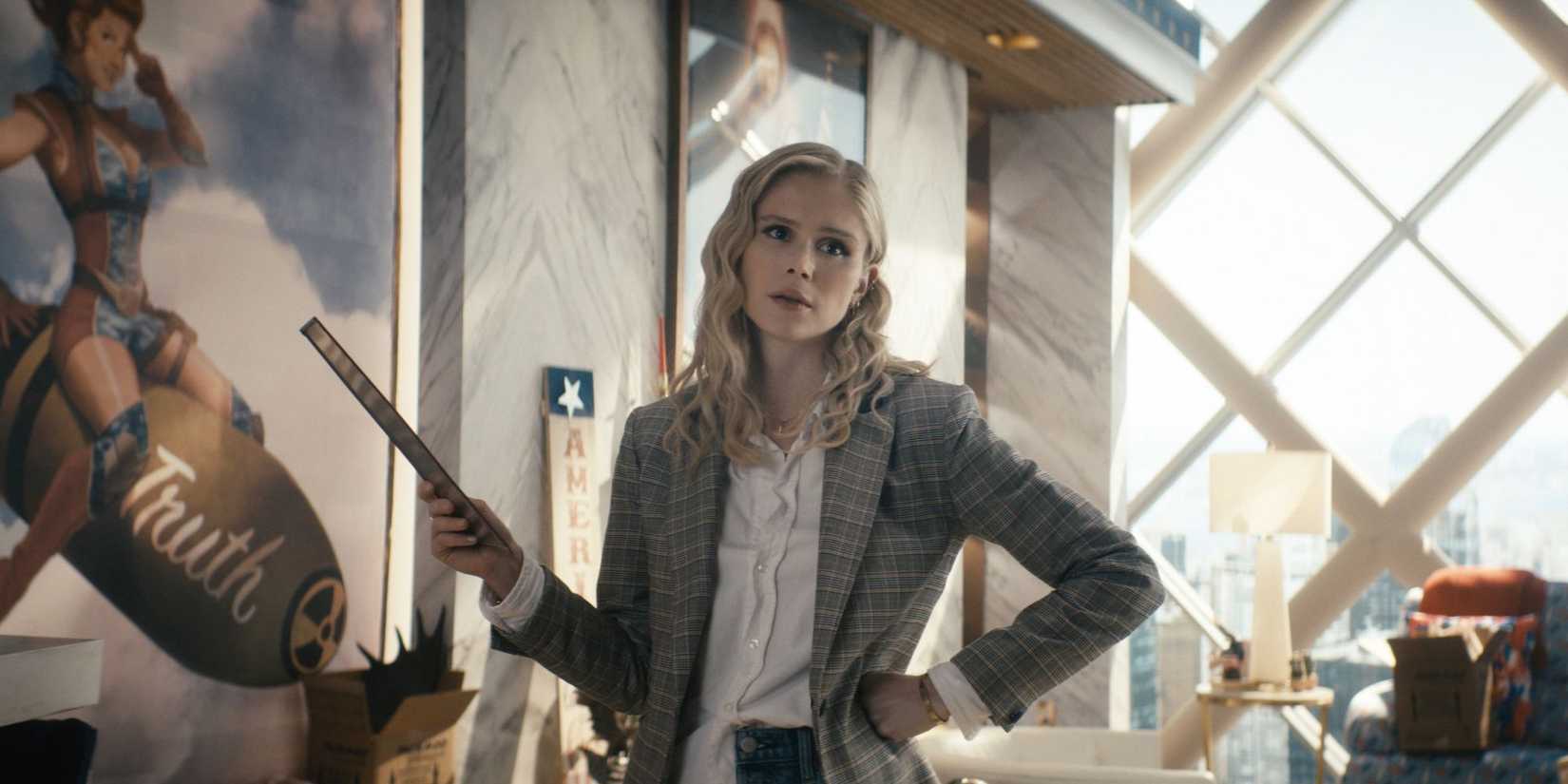 Erin Moriarty as Annie January in 'The Boys' wears a plaid blazer and holds a ruler