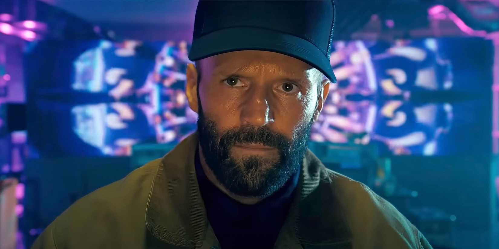 Jason Statham wears a black hat and investigates suspects in 'The Beekeeper' image