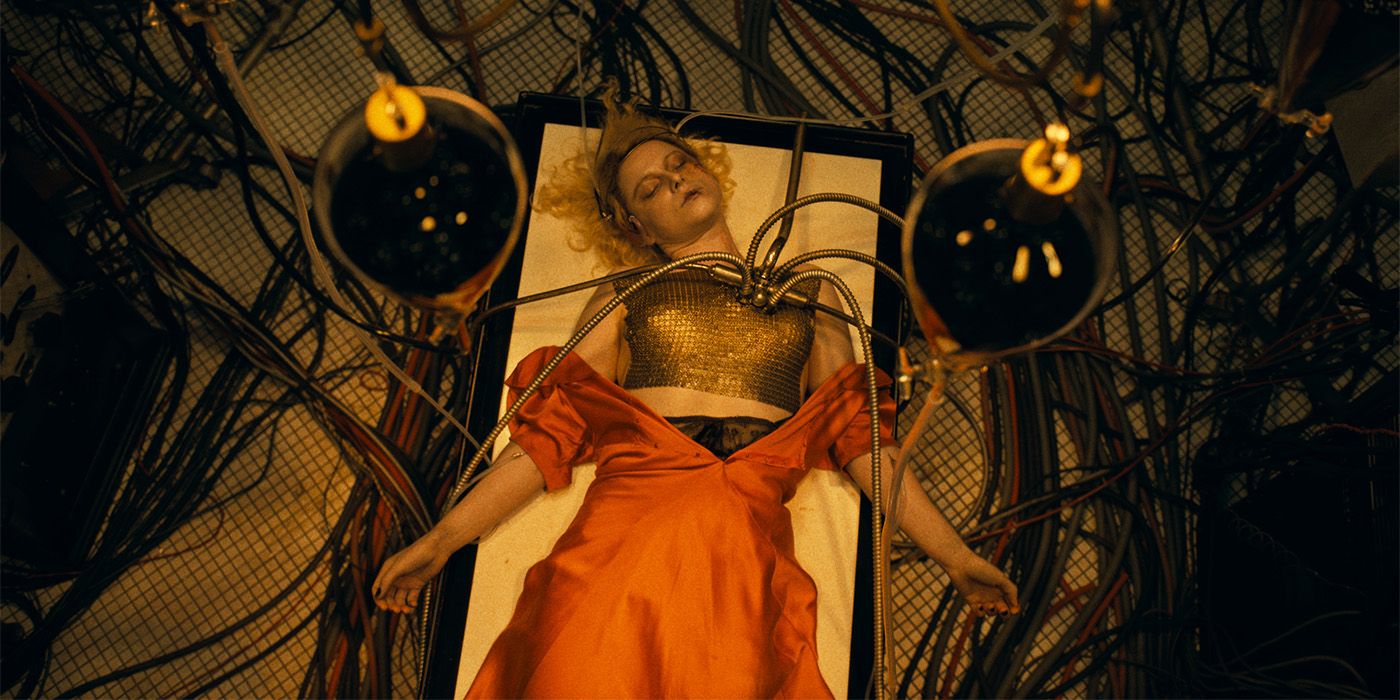 The Bride is lying on an operating table with cables hooked to her heart.