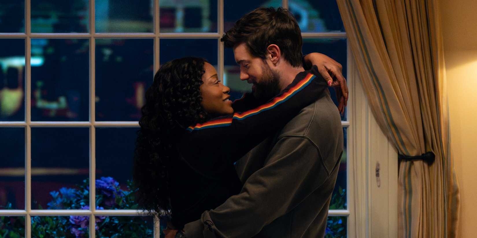 Keke Palmer as Samira with her arms around Jack Whitehall as Rob before they kiss in The 'Burbs