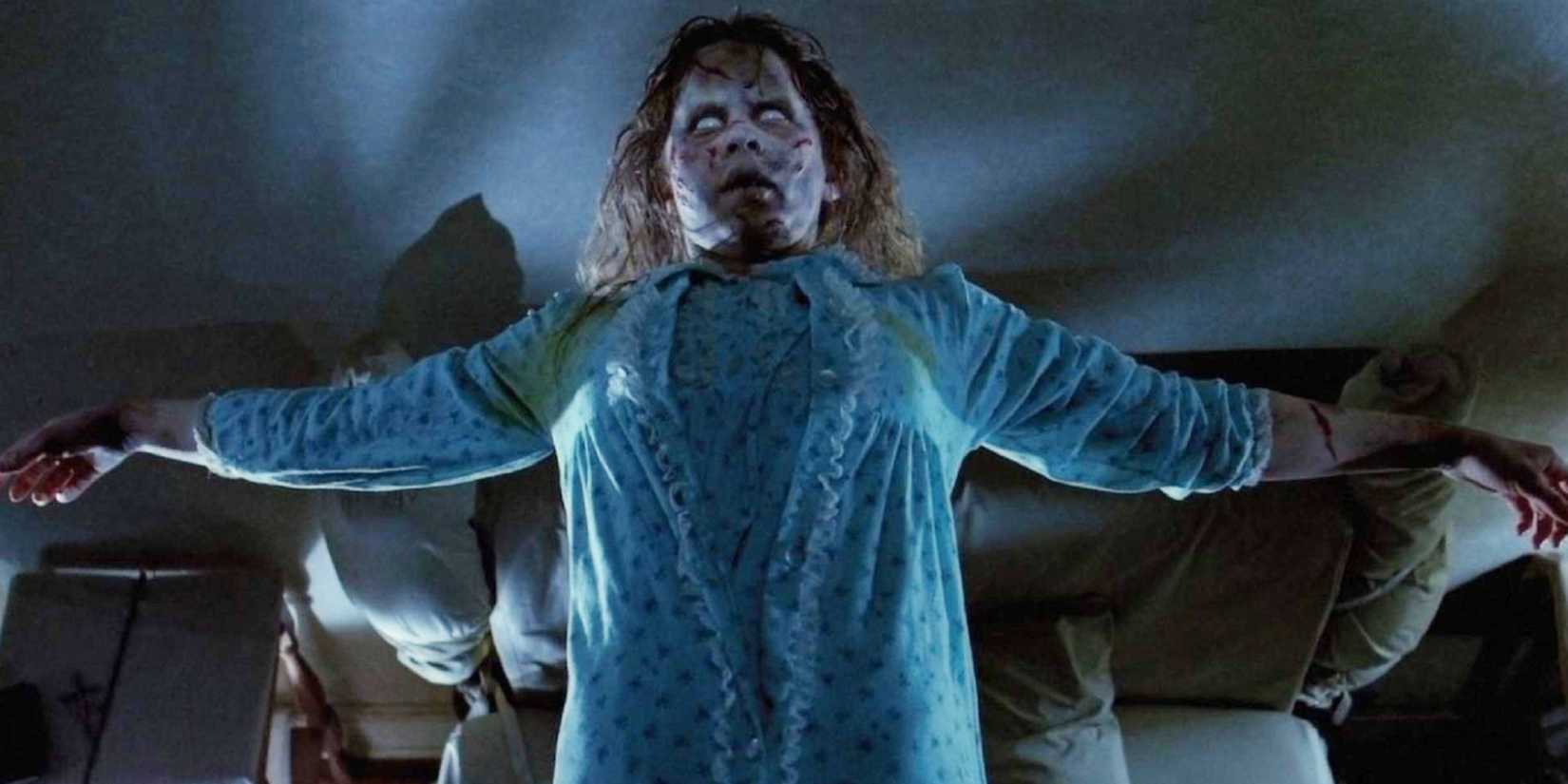 A possessed Regan McNeil floating above her bed in The Exorcist