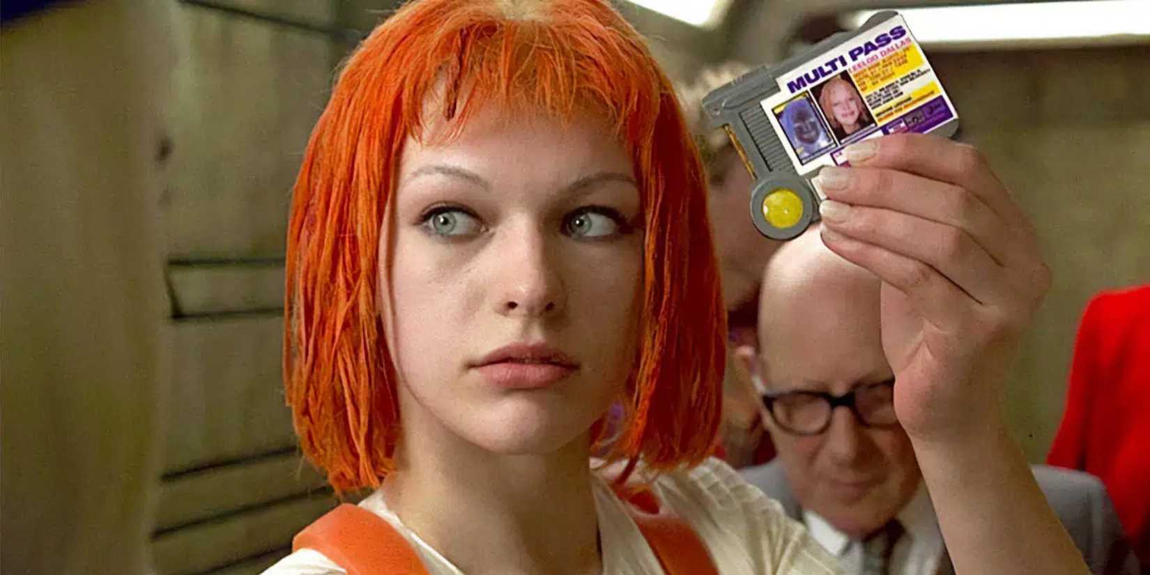 Milla Jovovich as Leeloo holding up her multipass in 'The Fifth Element'