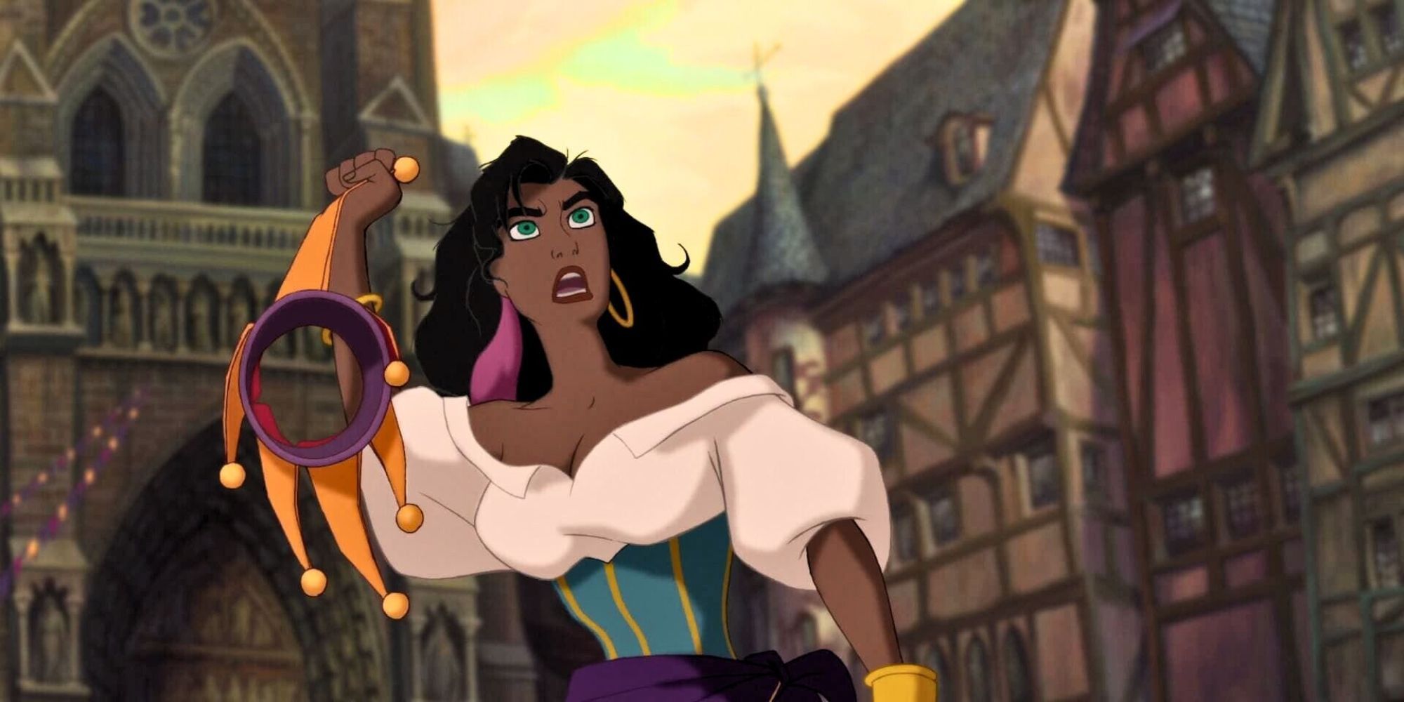 Demi Moore as Esmeralda holds a jester's hat and looks enraged in a city square in the animated The Hunchback of Notre Dame.