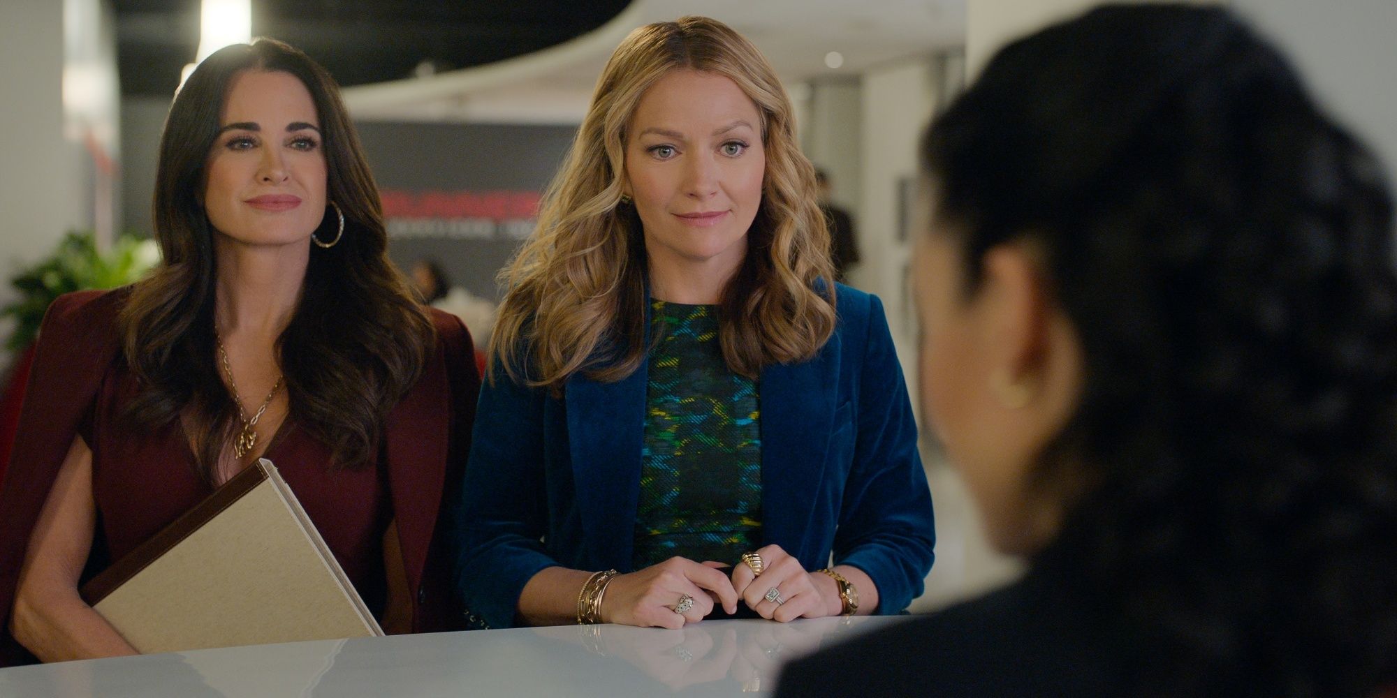 Becki Newton as Lorna with Kyle Richards as her client Celeste in The Lincoln Lawyer Season 4