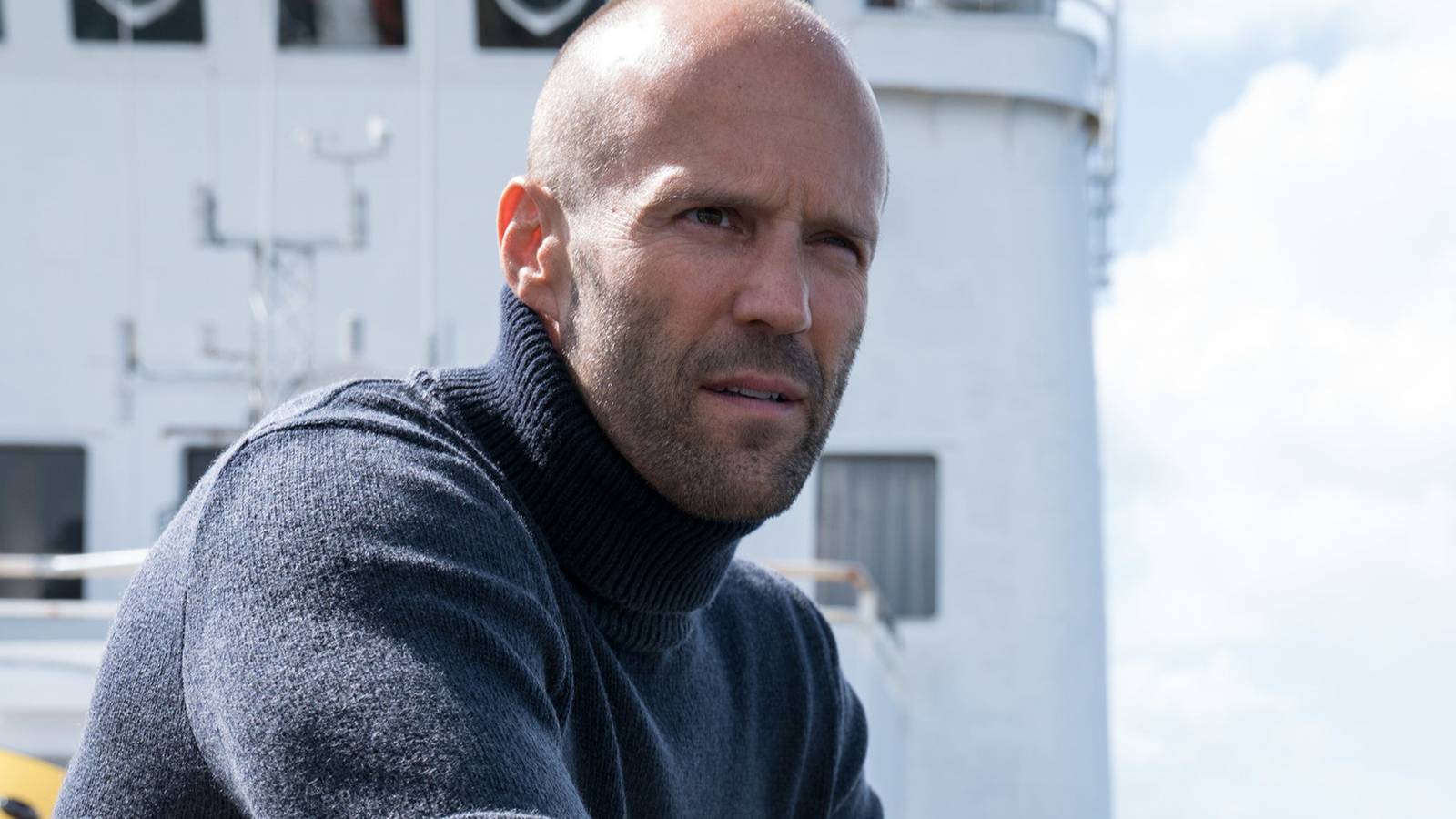 Jason Statham staring off a boat in The Meg