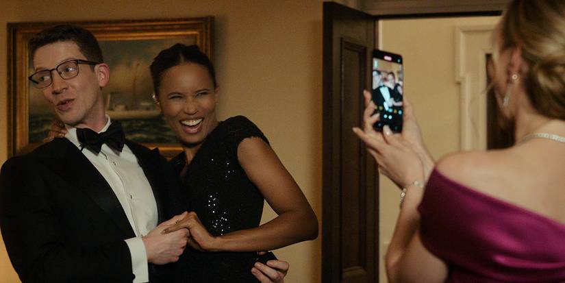 Chelsea and her fiancé posing for a photo in The Night Agent.