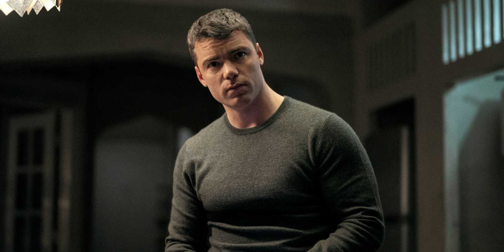 The Night Agent Season's Gabriel Basso stands in a room looking at someone off camera