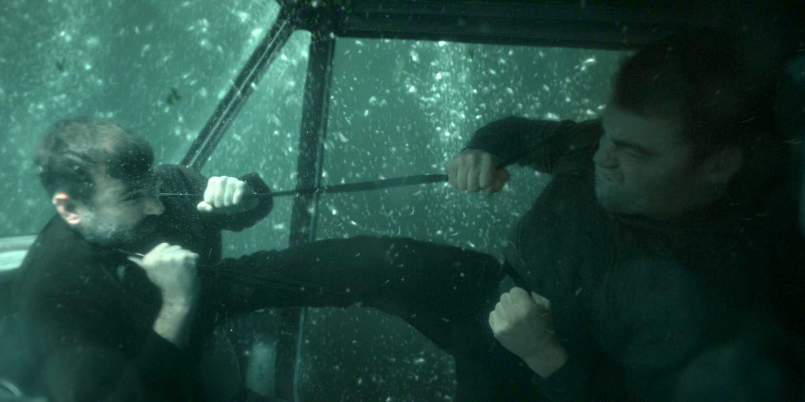 Gabriel Basso as Peter Sutherland in an underwater fight scene in The Night Agent Season 3