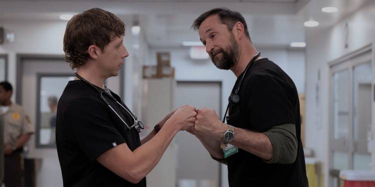 A fist bump between Dennis Whitaker (Gerran Howell) and Dr. Robby (Noah Wyle) on 'The Pitt'