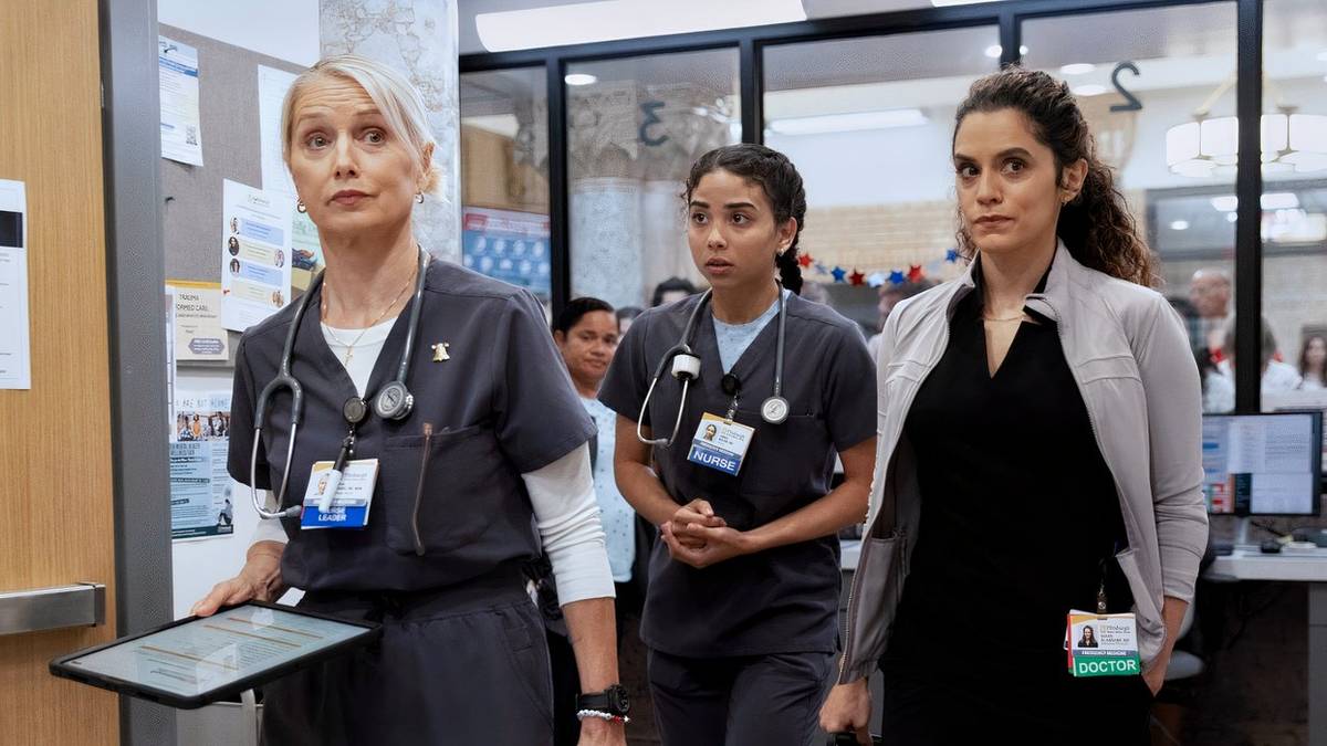 Emma Nolan and Dr. Baran Al-Hashimi walking closely behind Dana Evans in The Pitt Season 2 Episode 7