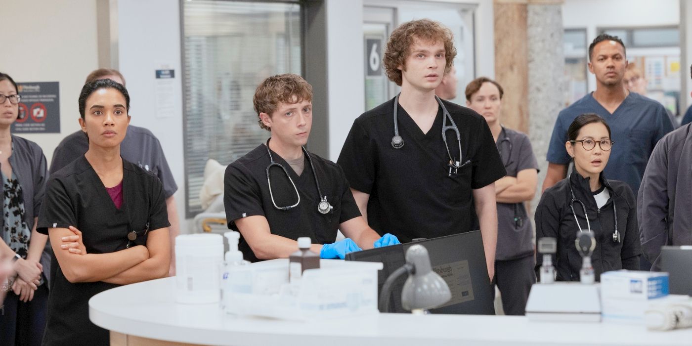 Mohan, Whitaker, Ogilvie, and Joy standing at the nurses main desk in The Pitt Season 2 Episode 7