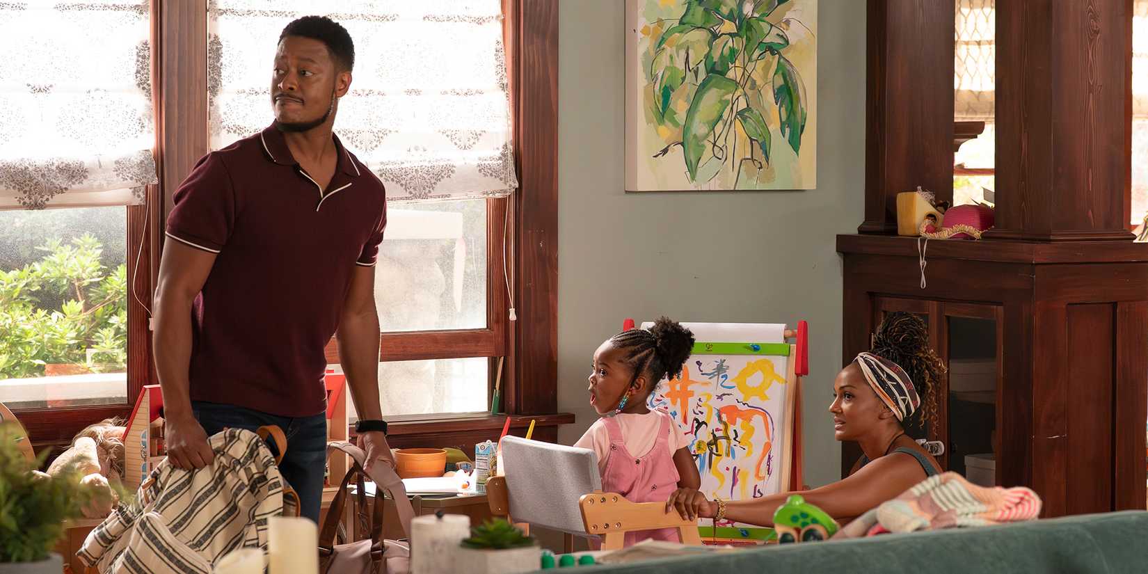 Arjay Smith as James with Mekia Cox as Nyla and their daughter in The Rookie