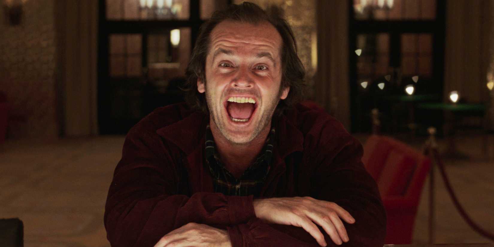 Jack Nicholson as Jack Torrance sitting at a bar and looking mad in The Shining (1980)