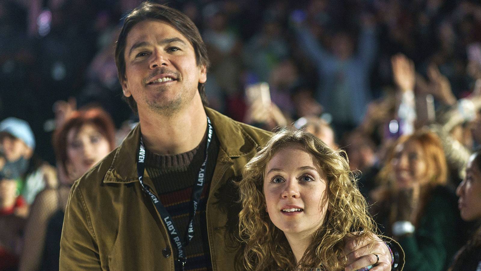 Josh Hartnett and Ariel Donoghue stand in the pit of a concert in Trap