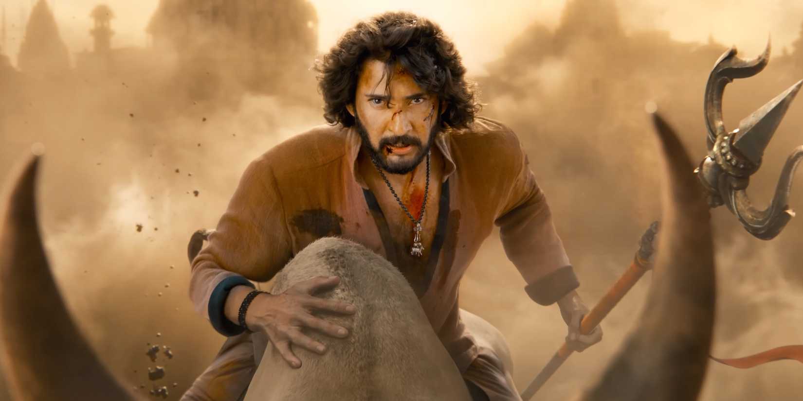 Rudhra riding on the back of an animal and holding a trident.