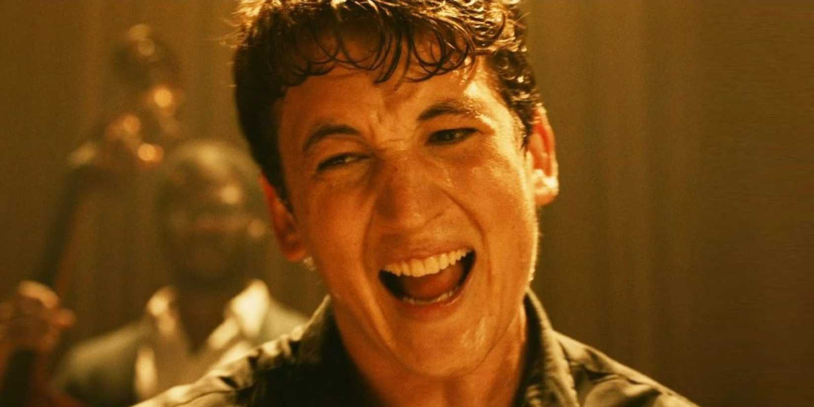 Miles Teller screaming while sitting behind a drumset in Whiplash (2014)