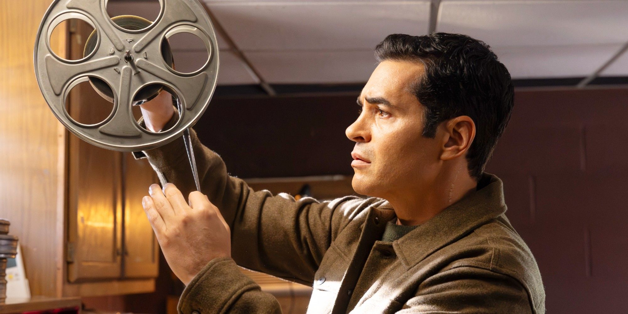 Will Trent looking through film reel in Will Trent Season 4 Episode 8