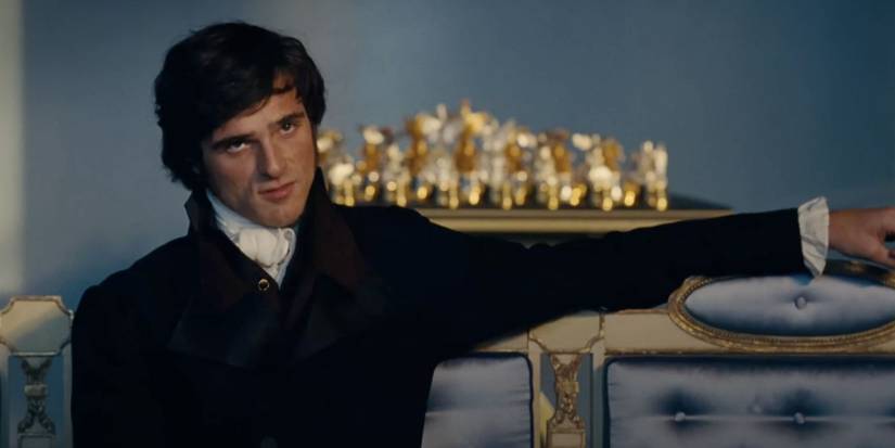 Jacob Elordi as Heathcliff sitting in Emerald Fennell's 'Wuthering Heights'