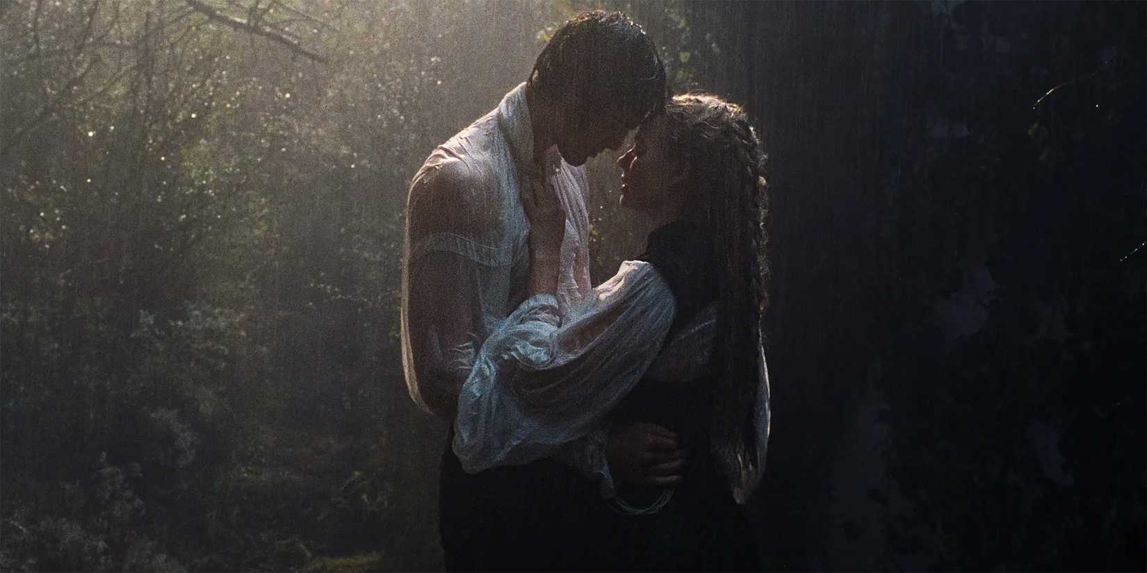 Margot Robbie as Catherine and Jacob Elordi as Heathcliff holding each other in the rain in Wuthering Heights