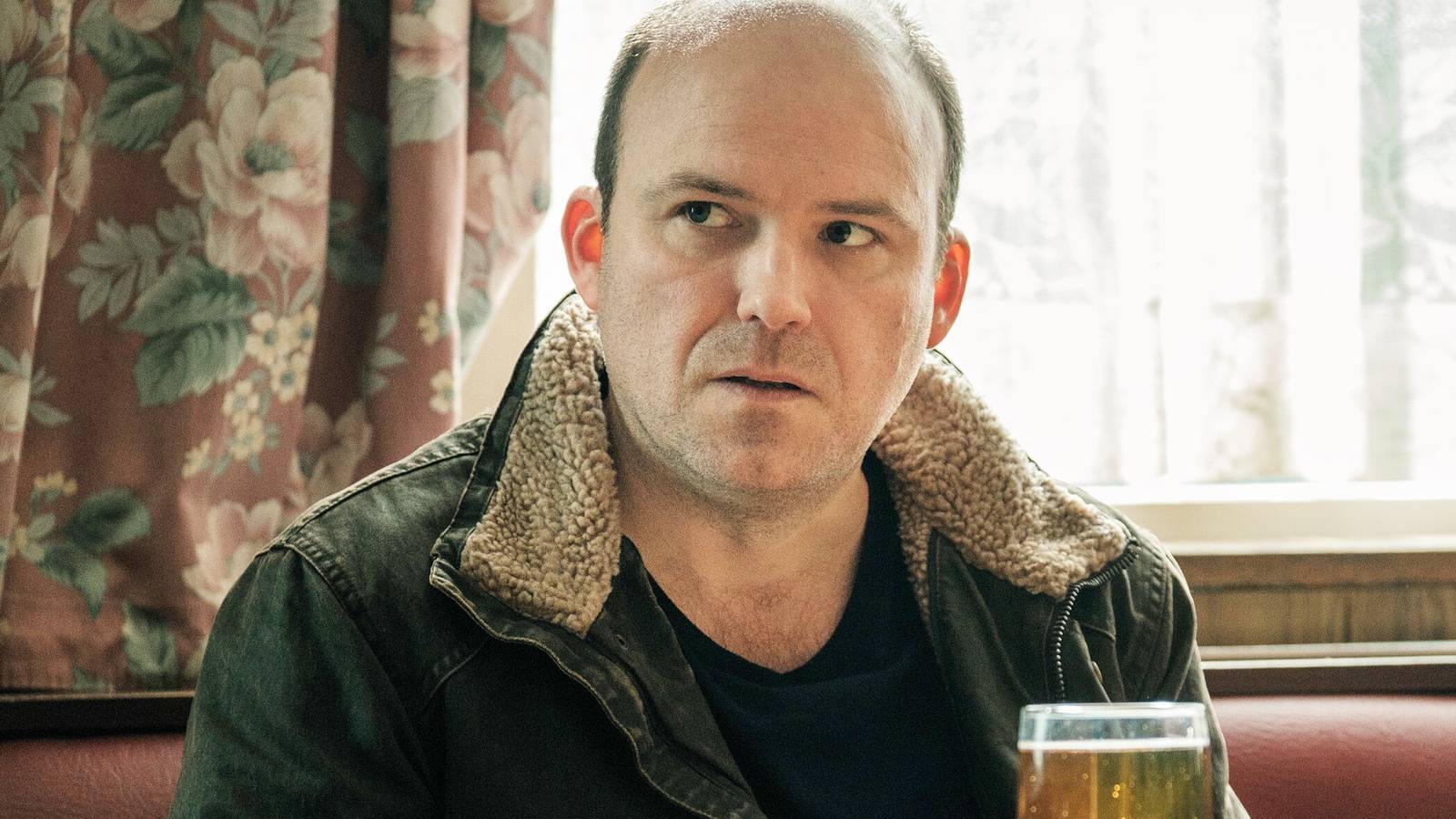 Rory Kinnear looking annoyed with a beer in Years and Years