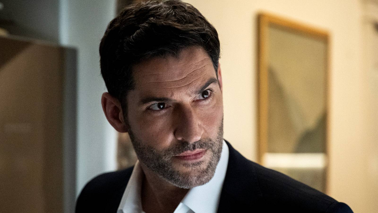 Tom Ellis staring wide-eyed at something in CIA