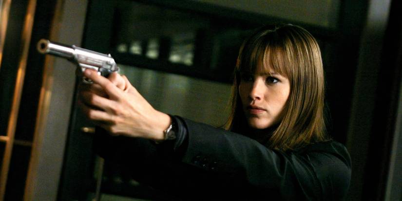 Sydney aiming a gun toward the left in Alias