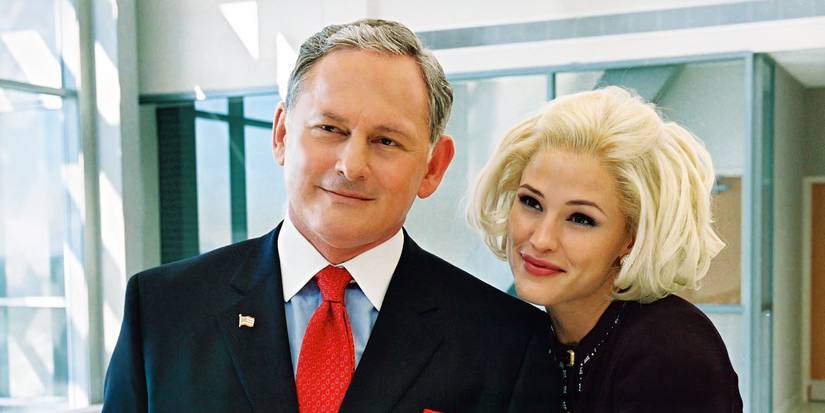 Sydney wearing a white blonde bob wig and smiling as she stands next to Jack in Alias