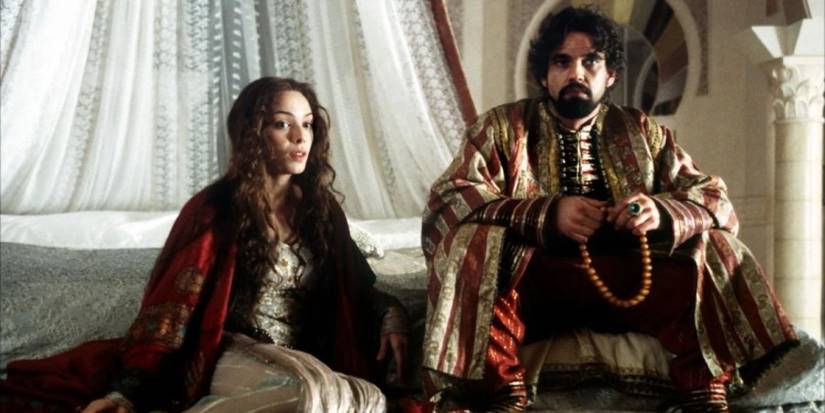 Two characters sitting together in 'Arabian Nights'