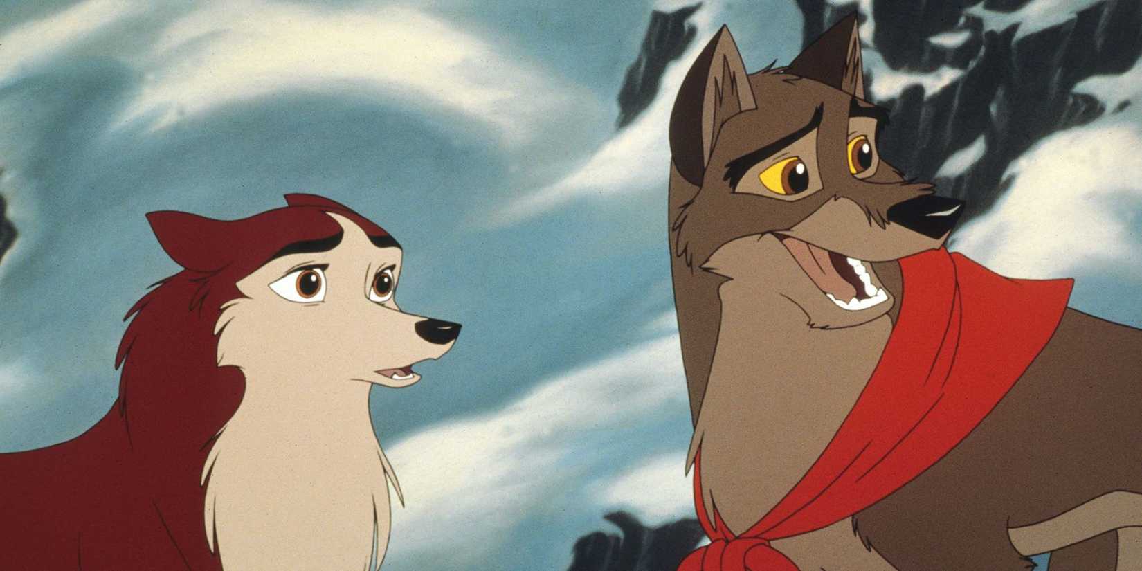 Two dogs, Jenna and Balto, talking and looking in the same direction, outdoors in snow in Balto