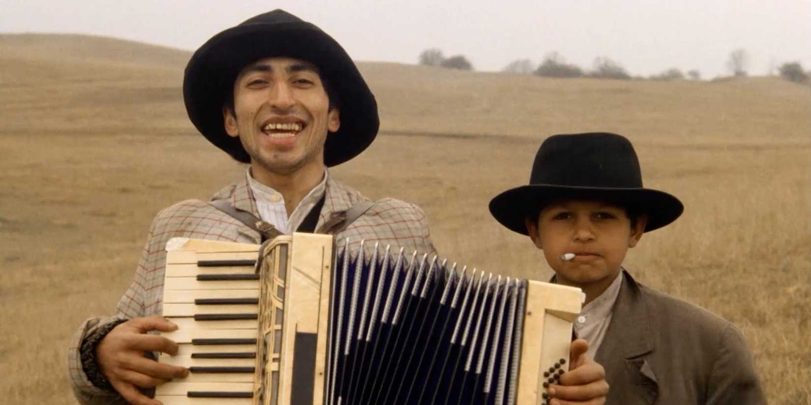 Boy and young man with accordion in 'Who's Singin' Over There'