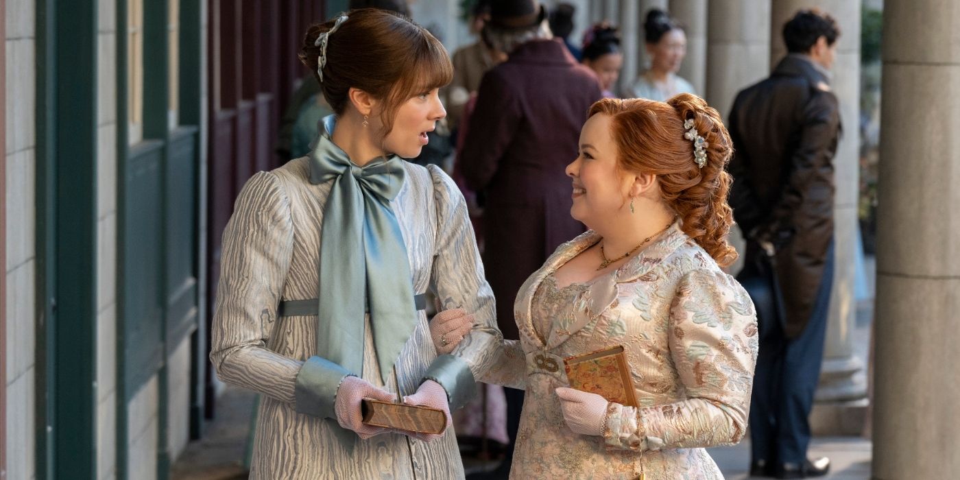 Eloise (Claudia Jessie) looks at Penelope (Nicola Coughlan) with surprise in Bridgerton