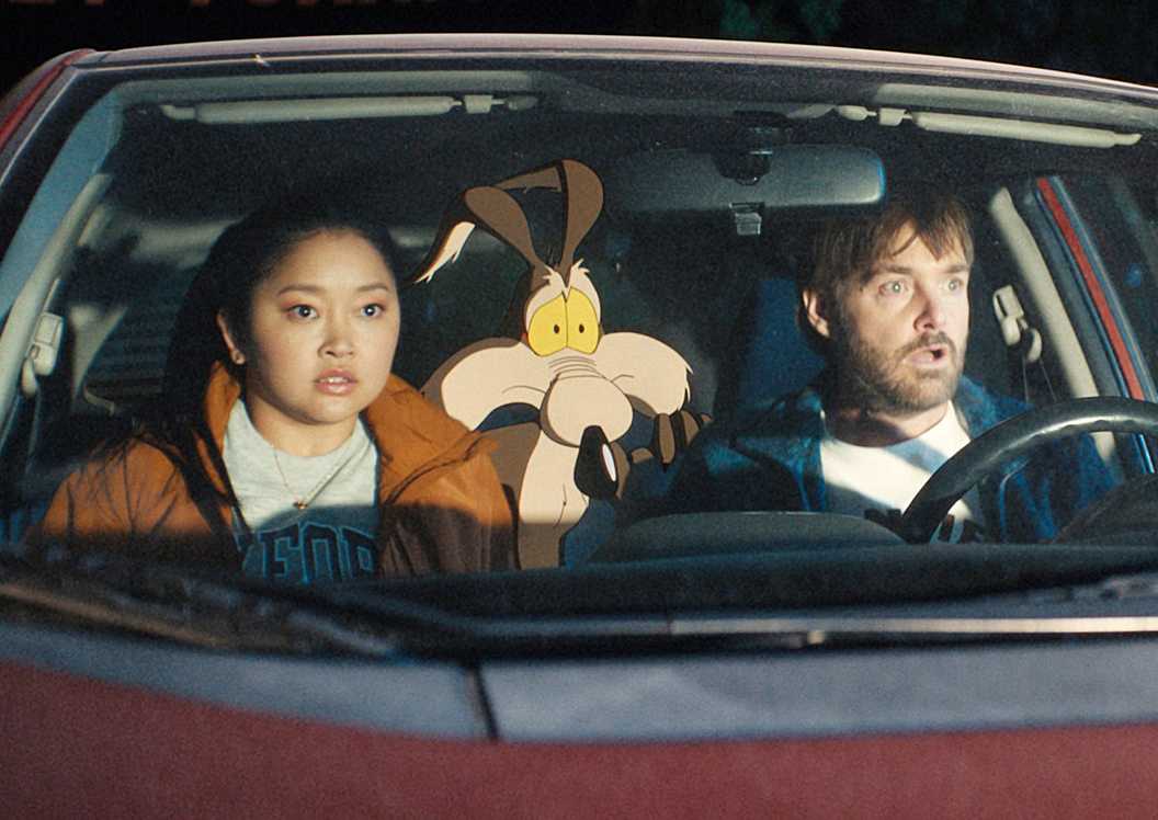 Will Forte drives a vehicle with Wile E. Coyote in the back in 'Coyote vs. Acme' image