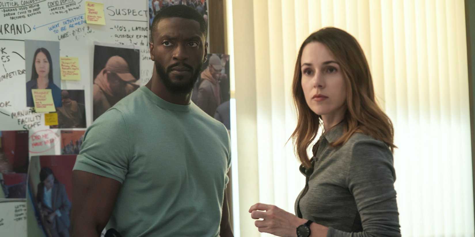 Aldis Hodge as Alex Cross standing in the police station with Alona Tal as Kayla Craig in Cross Season 2