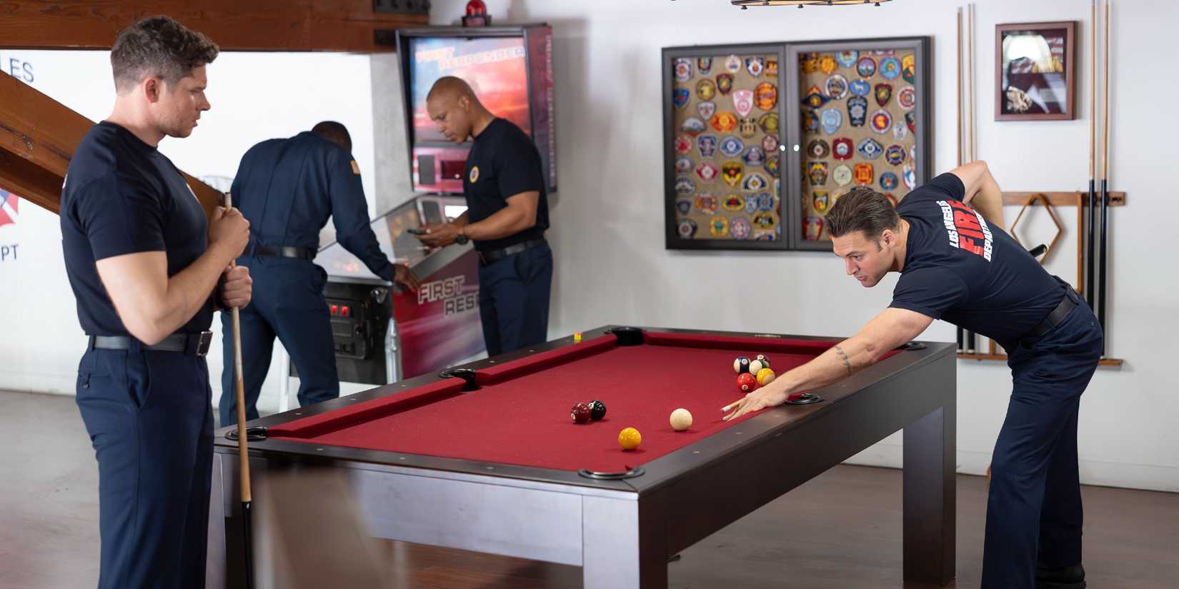 Buck and Eddie playing pool together in 9-1-1 Season 9 Episode 14