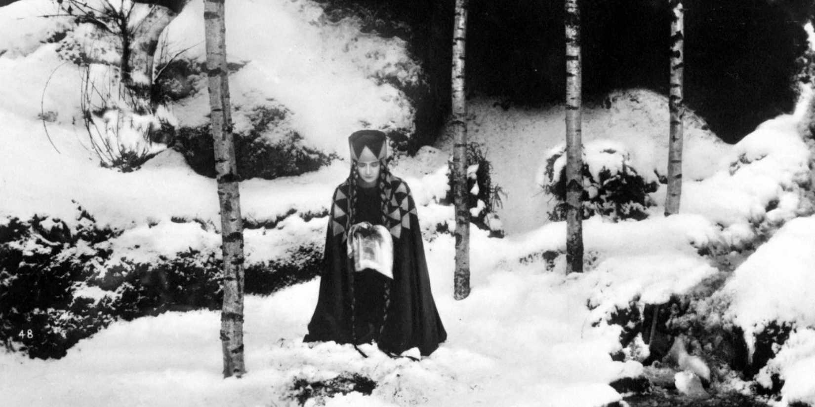 A woman in a snowy forest in Die Nibelungen_ Kriemhild's Revenge