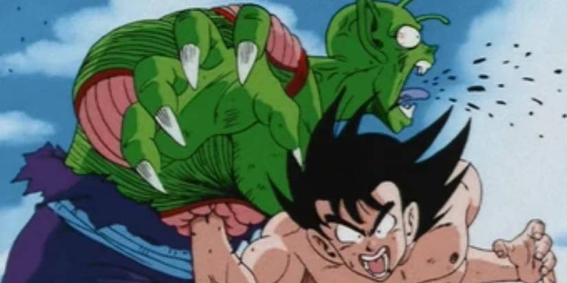 Goku punching Piccolo in the stomach in Dragon Ball