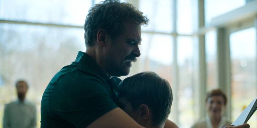 Floyd (David Harbour) hugging Richard (Arlan Ruf) during therapy in 'DTF St. Louis.'
