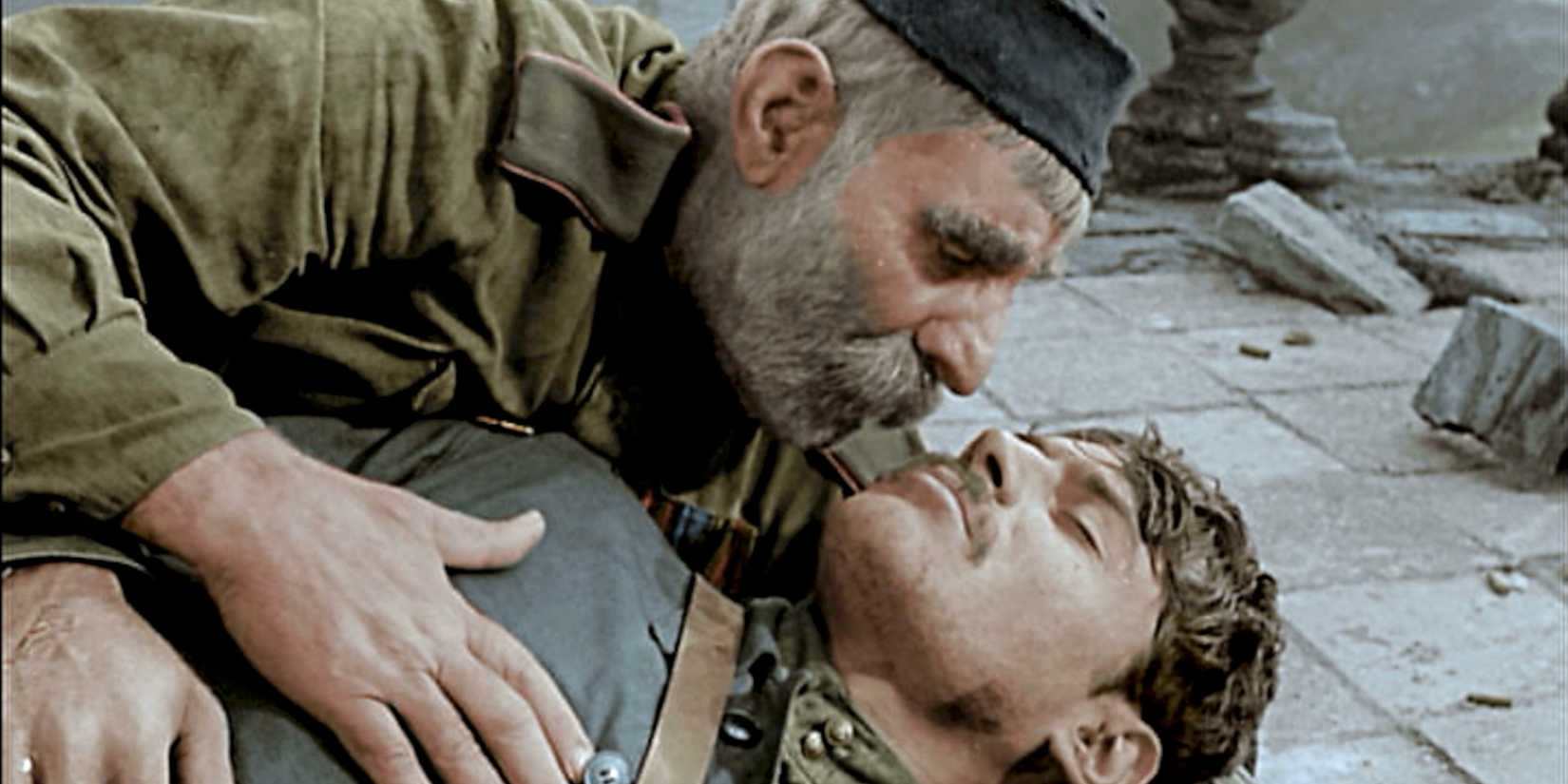 Father holding soldier son in 'Father of a Soldier'