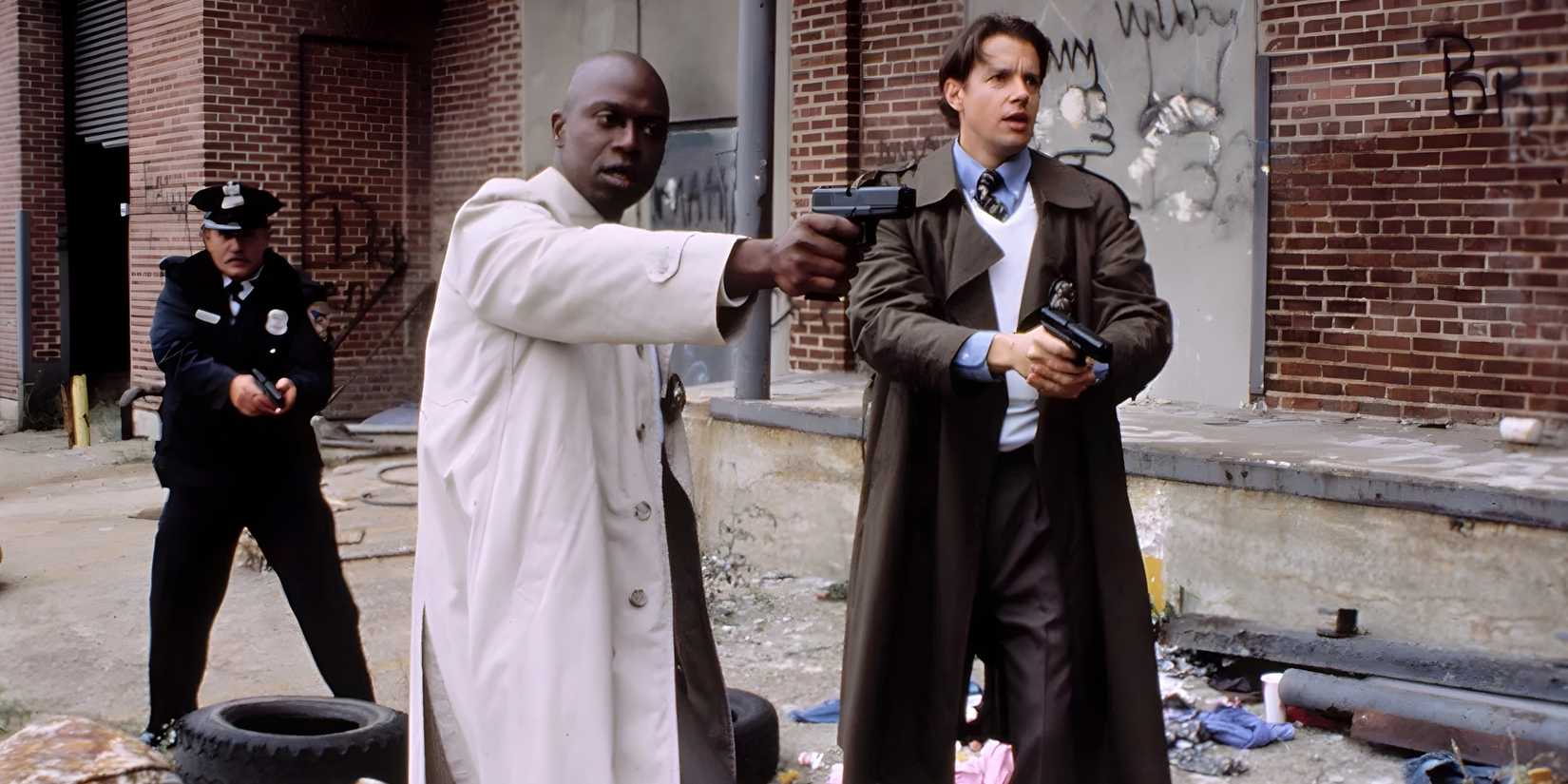 Frank Pembleton (Andre Braugher) and Tim Bayliss (Kyle Secor) with guns drawn in Homicide: Life on the Street.