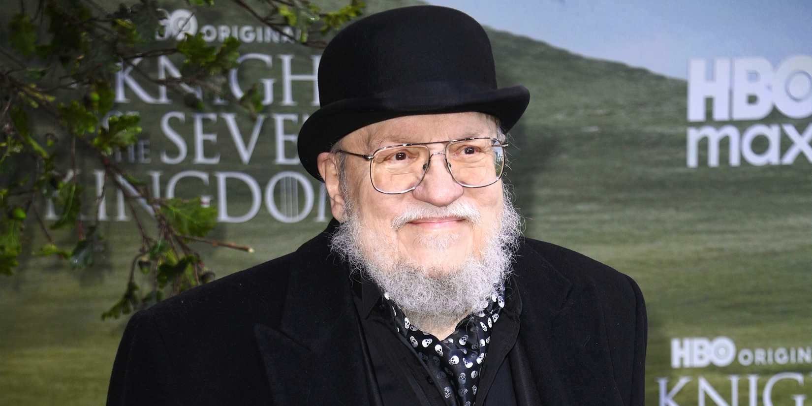 George R.R. Martin smiling on the red carpet